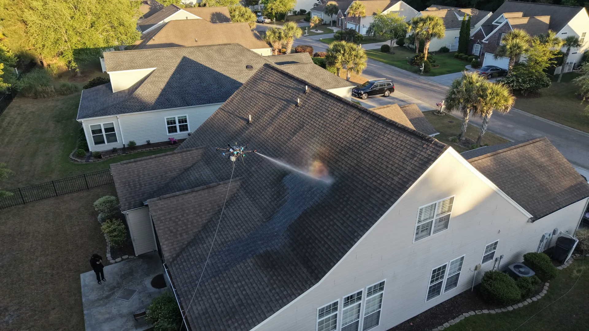 Drone roof cleaning in action